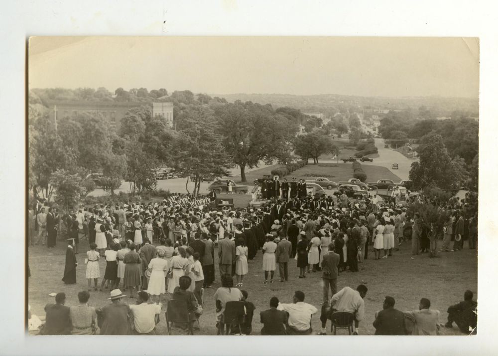 Samuel Huston College convocation ceremony in the median of East Avenue, 1947.